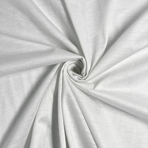 Closeup of white jersey knitted fabric with gold lurex threads knitted into the structure giving it a lustrous sheen