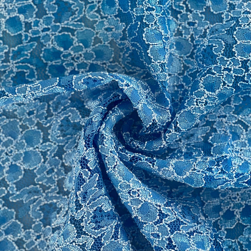 A swatch of blue polyester lace fabric with a floral pattern and embossed detailing.