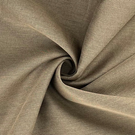 Closeup of khaki and black broken twill zig-zag suiting folded into a swirl. 